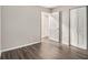 Spacious bedroom with wood-look floors and access to another room at 3599 Woodbriar Cir # E, Tucker, GA 30084