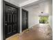 Shared entryway with two black doors and welcome mats at 3599 Woodbriar Cir # E, Tucker, GA 30084