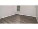 Simple bedroom with wood-look floors and neutral walls at 3599 Woodbriar Cir # E, Tucker, GA 30084