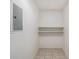 Small storage room with shelving and tile floor at 3599 Woodbriar Cir # E, Tucker, GA 30084