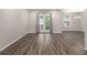 Spacious living room with hardwood floors and access to balcony at 3599 Woodbriar Cir # E, Tucker, GA 30084