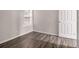 Spacious bedroom with wood-look floors and a closet at 3599 Woodbriar Cir # E, Tucker, GA 30084