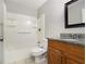 Bathroom with granite countertop vanity and shower/tub combo at 3599 Woodbriar Cir # E, Tucker, GA 30084