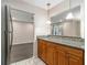 Kitchen features granite countertops and wood cabinets at 3599 Woodbriar Cir # E, Tucker, GA 30084