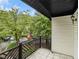 Private balcony overlooks a wooded area with parking visible at 3599 Woodbriar Cir # E, Tucker, GA 30084