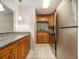 Galley kitchen with granite counters and stainless steel appliances at 3599 Woodbriar Cir # E, Tucker, GA 30084