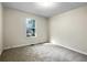 Bright bedroom with neutral carpet and large window at 101 Dodd St, Fairburn, GA 30213