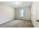 Spacious bedroom with neutral carpet and window at 101 Dodd St, Fairburn, GA 30213
