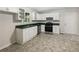 Modern kitchen with white cabinets and stainless steel appliances at 101 Dodd St, Fairburn, GA 30213