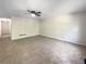 Spacious living room with ceiling fan and neutral carpeting at 101 Dodd St, Fairburn, GA 30213
