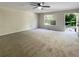 Spacious living room with neutral carpet and view of backyard at 101 Dodd St, Fairburn, GA 30213