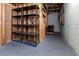 Unfinished basement area with shelving for storage at 3125 Lakeside Dr, Cumming, GA 30041