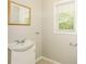 Simple bathroom with single sink and window at 3655 Leisure Ln, Atlanta, GA 30349