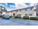 Exterior view of beige brick building with parking at 3212 Henderson Mill Rd # 2, Atlanta, GA 30341