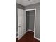 Walk-in closet with wood floors and a hanging rod at 9399 Whaleys Lake Ln, Jonesboro, GA 30238