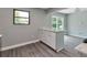 Modern kitchen featuring white cabinets, stainless steel appliances, and a large island at 910 Michael Dr, Atlanta, GA 30349