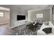 Bright living room featuring a comfy sofa and large TV at 910 Michael Dr, Atlanta, GA 30349