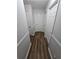 Gray hallway with wood-look flooring and doors at 4670 Eberline Ct, Stone Mountain, GA 30083