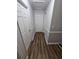Gray hallway with wood-look flooring and doors at 4670 Eberline Ct, Stone Mountain, GA 30083