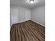 Bedroom with wood-look flooring and closet at 4670 Eberline Ct, Stone Mountain, GA 30083