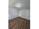 Bedroom with wood-look flooring and double closets at 4670 Eberline Ct, Stone Mountain, GA 30083
