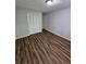 Bedroom with wood-look flooring and closet at 4670 Eberline Ct, Stone Mountain, GA 30083