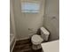 Bathroom with toilet and window at 4670 Eberline Ct, Stone Mountain, GA 30083