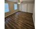 Spacious bedroom with ceiling fan, double closets, and wood-look floors at 4670 Eberline Ct, Stone Mountain, GA 30083