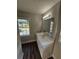 Bathroom with vanity, mirror, and window at 4670 Eberline Ct, Stone Mountain, GA 30083