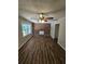 Living room with hardwood floors, brick fireplace and ceiling fan at 4670 Eberline Ct, Stone Mountain, GA 30083