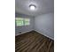 Bedroom with wood-look flooring and window at 4670 Eberline Ct, Stone Mountain, GA 30083