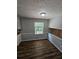 Dining area with hardwood floors and a view to backyard at 4670 Eberline Ct, Stone Mountain, GA 30083