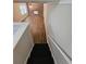 Stairs leading down to finished basement with brick fireplace at 4670 Eberline Ct, Stone Mountain, GA 30083