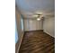 Ample bedroom with ceiling fan, double closets and wood-look floors at 4670 Eberline Ct, Stone Mountain, GA 30083