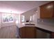 Eat-in kitchen with island and view to backyard at 221 Bridgemill Ln, Hampton, GA 30228