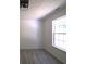 Bright bedroom with neutral walls and carpet flooring at 221 Bridgemill Ln, Hampton, GA 30228