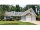 Two-story house with two-car garage at 221 Bridgemill Ln, Hampton, GA 30228