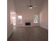 Spacious living room with fireplace and hardwood floors at 221 Bridgemill Ln, Hampton, GA 30228