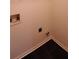 Laundry room with hookups and dark tile floor at 221 Bridgemill Ln, Hampton, GA 30228