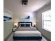 Spacious primary bedroom with large window and plush bedding at 221 Bridgemill Ln, Hampton, GA 30228