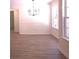 Simple dining room with hardwood floor at 221 Bridgemill Ln, Hampton, GA 30228
