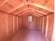 Empty shed interior with wood paneling and a small window at 221 Bridgemill Ln, Hampton, GA 30228