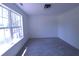 Spacious bedroom with large window and neutral decor at 221 Bridgemill Ln, Hampton, GA 30228