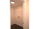 Bright laundry room with shelving and dark tile floor at 221 Bridgemill Ln, Hampton, GA 30228