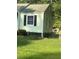 Side view of a light green house with a chain link fence at 939 Beecher Sw Ct, Atlanta, GA 30311