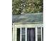 Close-up of a light green house exterior and roof at 939 Beecher Sw Ct, Atlanta, GA 30311