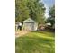 Detached garage with driveway and green lawn at 939 Beecher Sw Ct, Atlanta, GA 30311