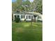 Ranch house with green exterior and lawn at 939 Beecher Sw Ct, Atlanta, GA 30311