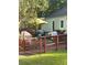 Wooden deck with patio furniture and umbrella at 939 Beecher Sw Ct, Atlanta, GA 30311