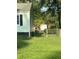 Side view of a light green house with a shed and fence at 939 Beecher Sw Ct, Atlanta, GA 30311